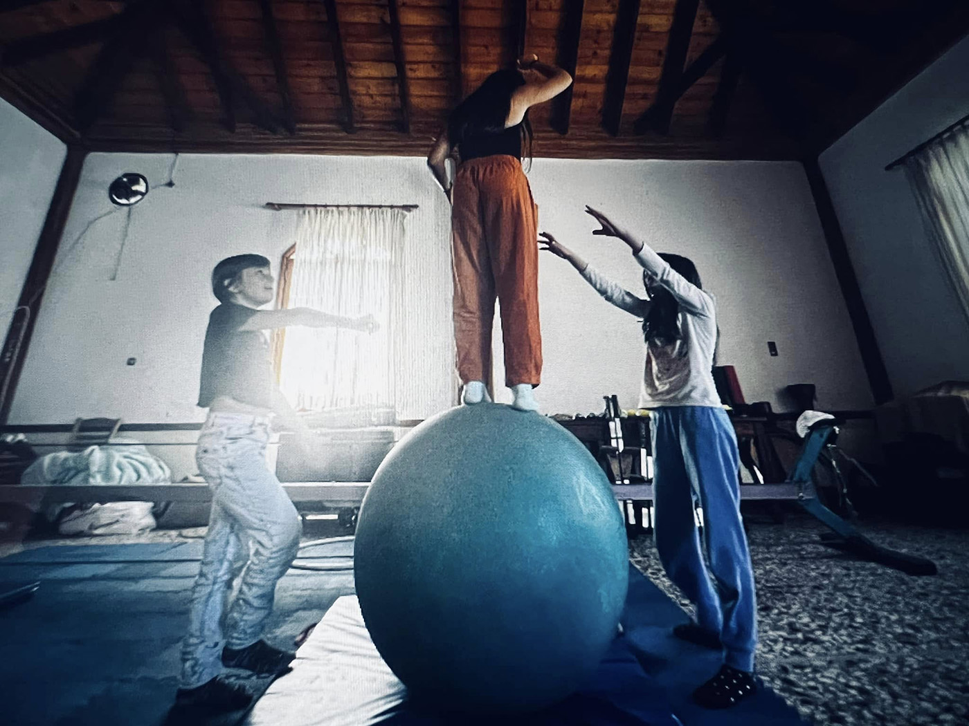 Children performing in a puppet and acrobatics workshop presentation