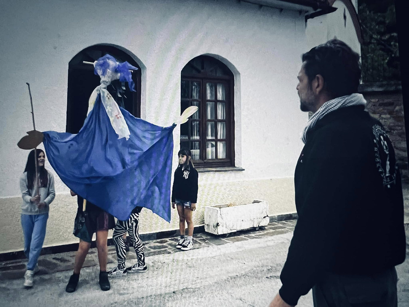 Giant puppet doll in street performance -go to Collective Work